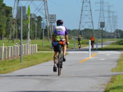 bicyclists ride on a newly completed section of the Pinellas Trail