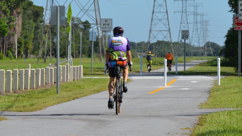 bicyclists ride on a newly completed section of the Pinellas Trail