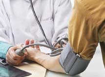 medical staff taking patients blood pressure