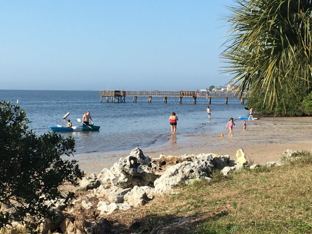 families enjoying the beach and pier at Crystal Beach