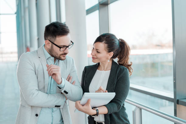 Two business people discussing about work.