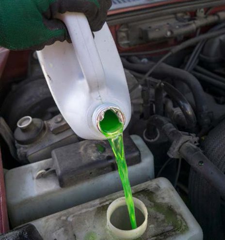 pouring antifreeze