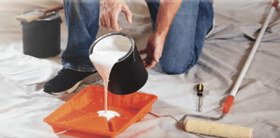 painter pouring paint