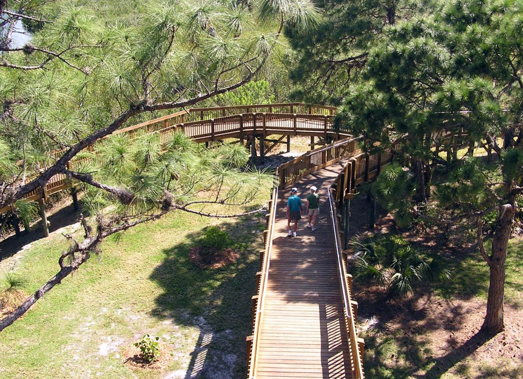 Man and woman walking on a bridge