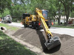 Public Works Gradall improving flood prevention