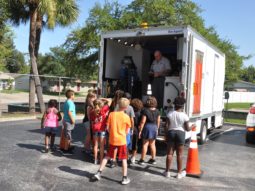 Pinellas County UTI employee shows kids a sewer camera during Pinellas Promise