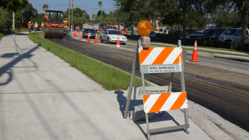 Pinellas County Public Works paving a road