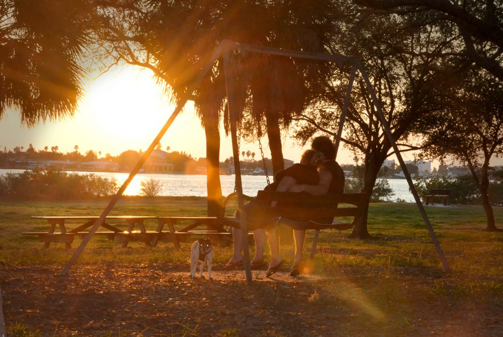 A couple enjoying the sunset at War Veterans' Memorial Park