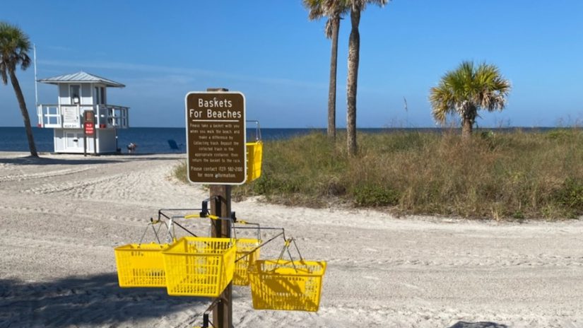 yellow trash collection baskets available on on sunny beach