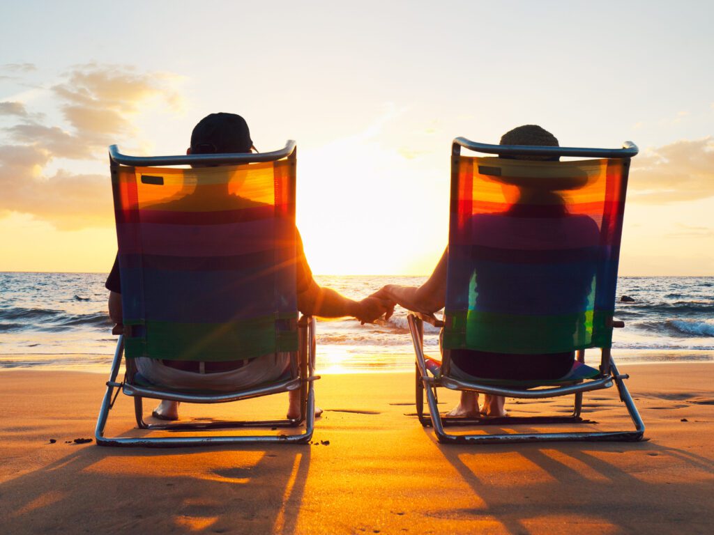 Happy Romantic Couple Enjoying Beautiful Sunset at the Beach