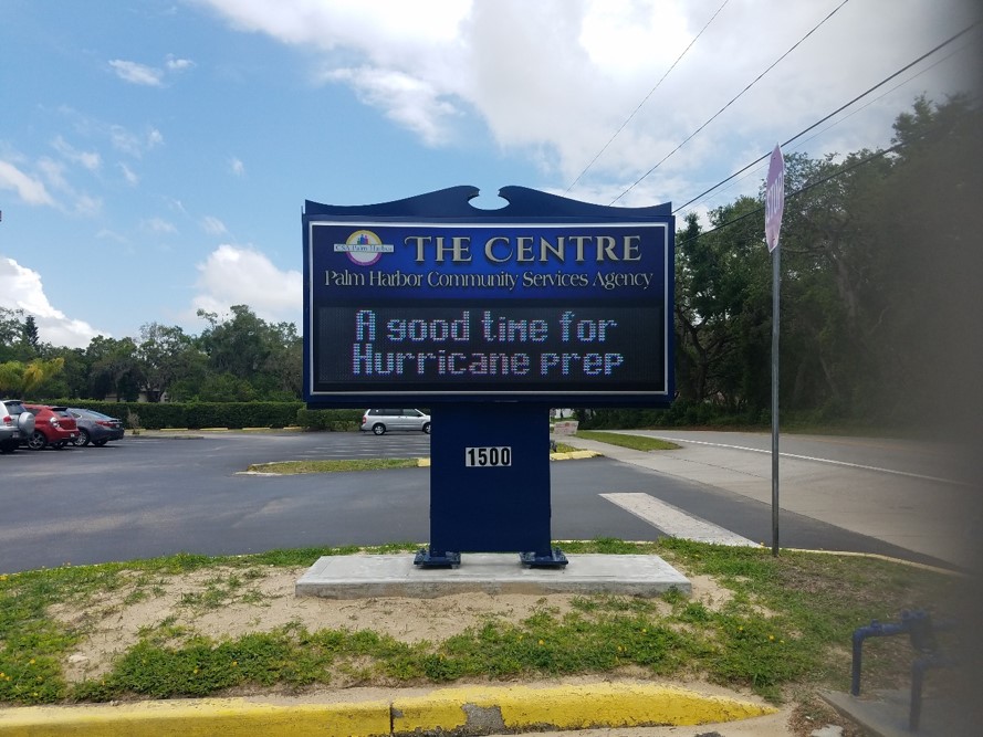 Photo of an electronic billboard with a message that reads "A good time for hurricane prep"