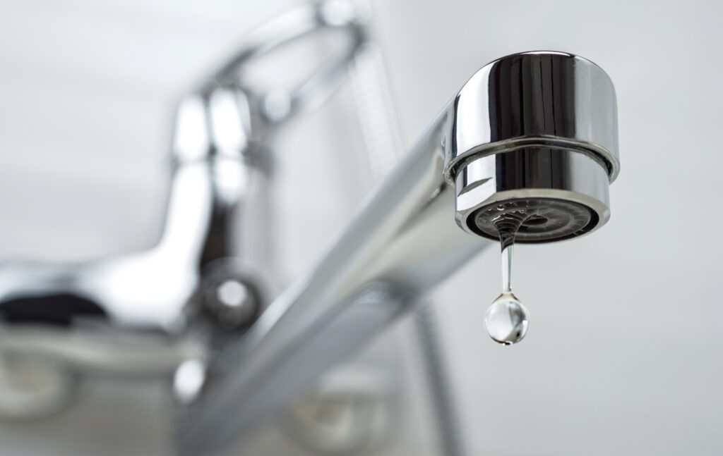 Photo of a faucet with water dripping