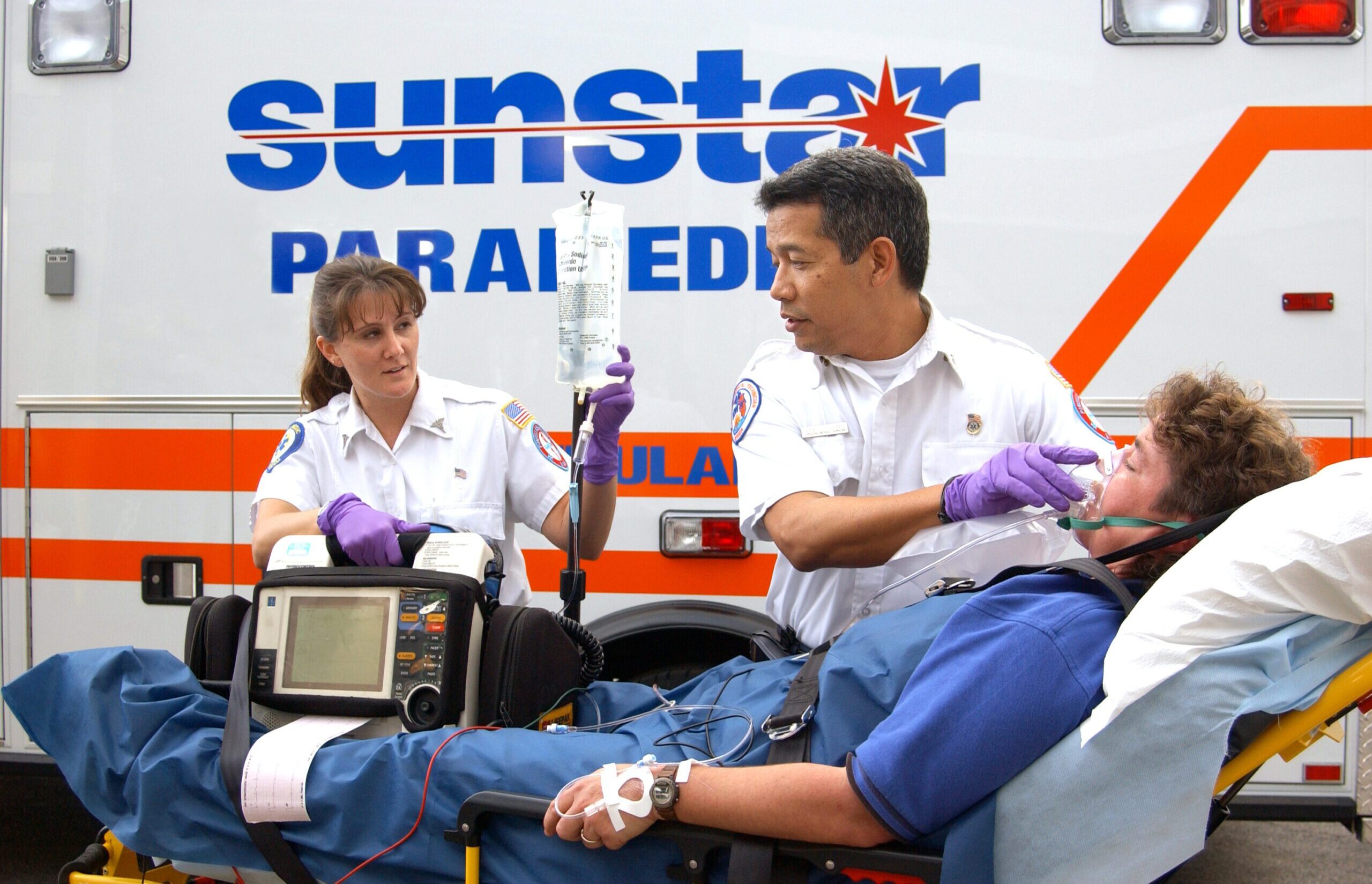 First responders assist an ambulance patient