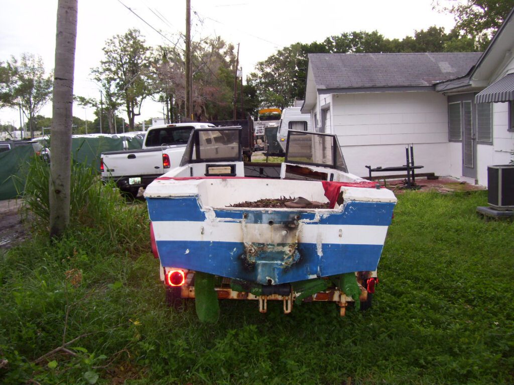 boat stored in front yard