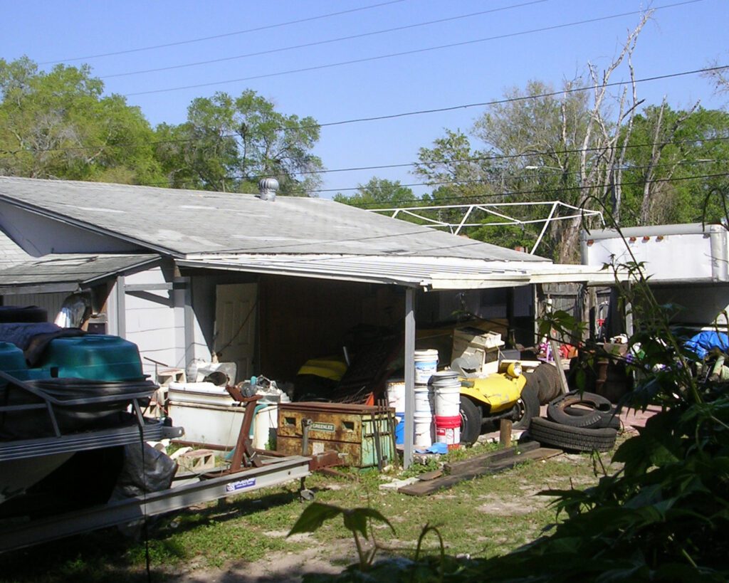 junk surrounding a house