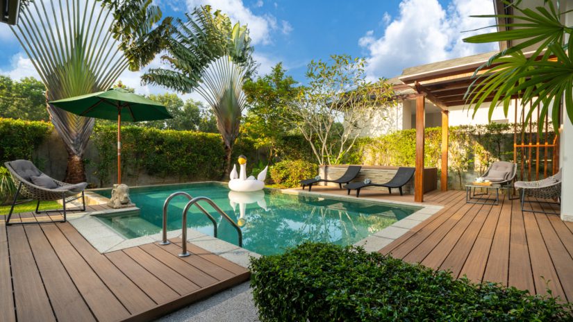 residential swimming pool surrounded by a barrier