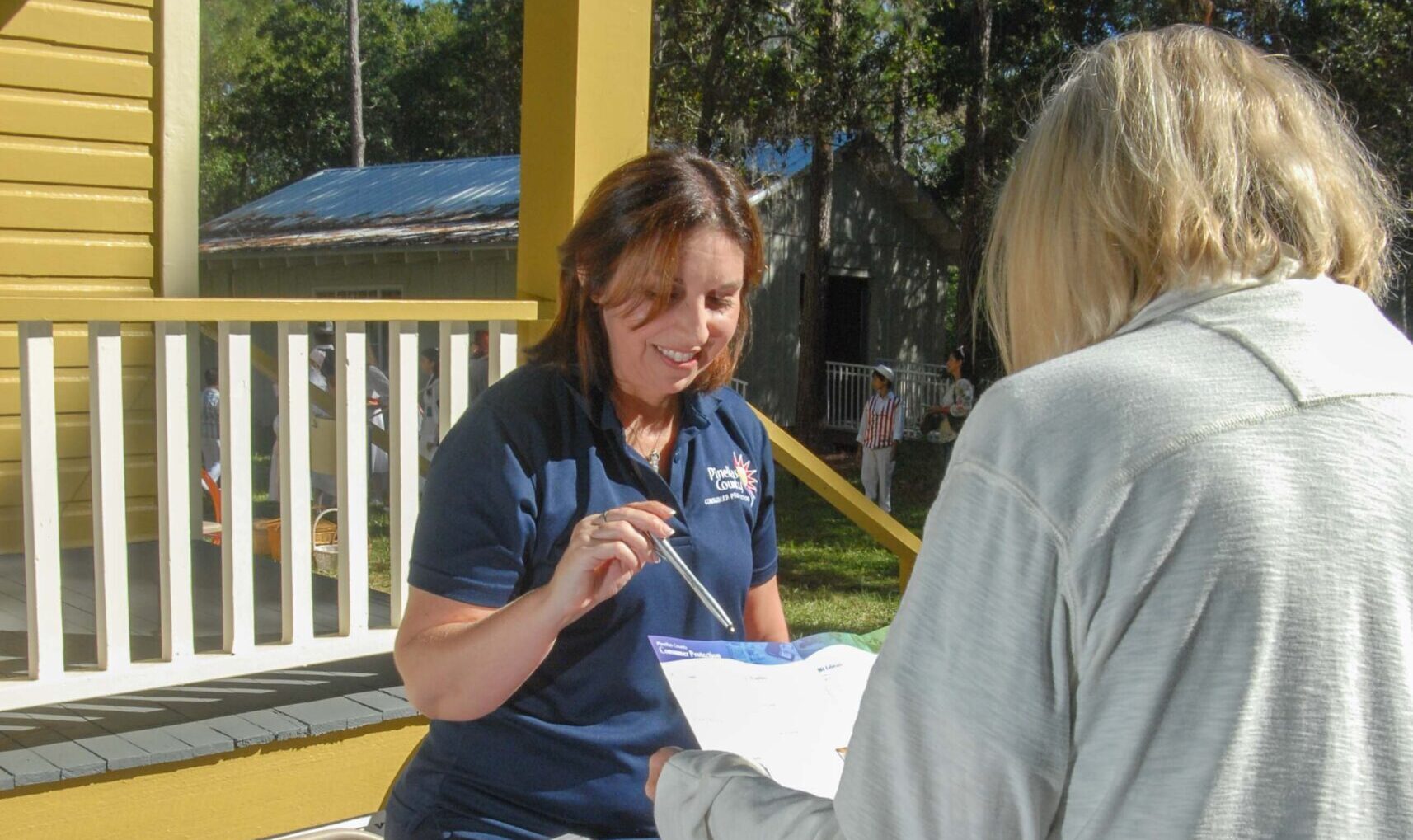 Consumer Protection staff working with county resident.