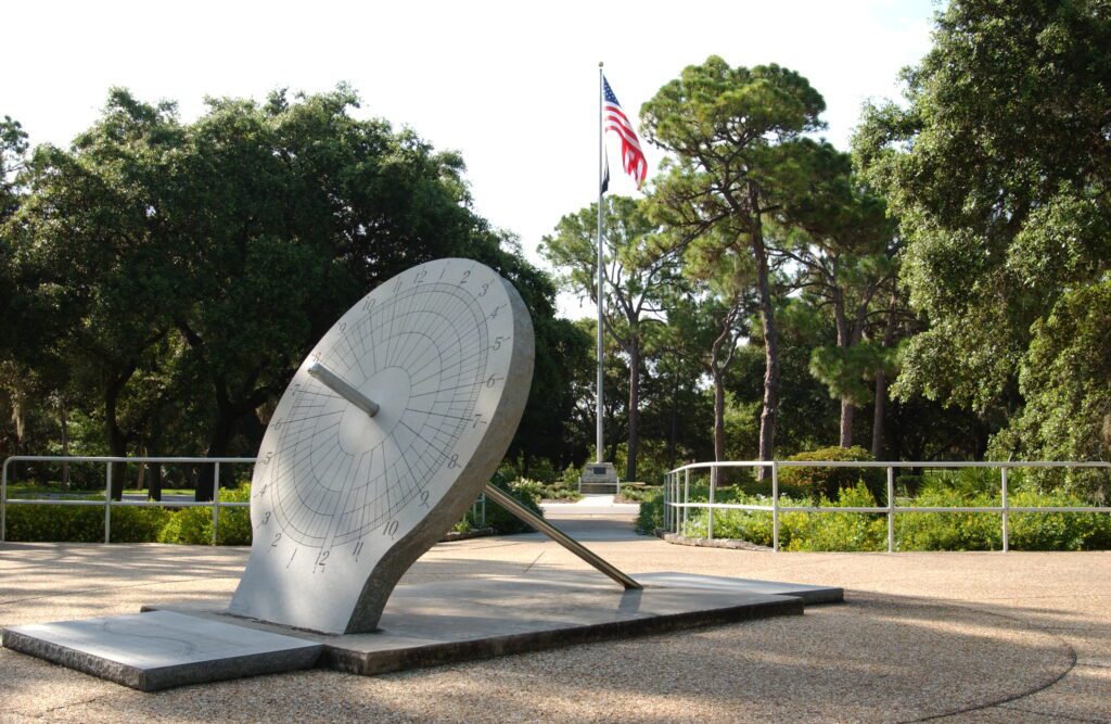 sundial and flag at War Veterans' Memorial Park