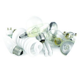 Mixed heap of light bulbs with filament bulbs and energy salving lamps