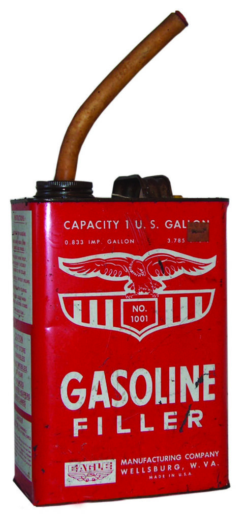 old fashioned red gas can with spout and white lettering