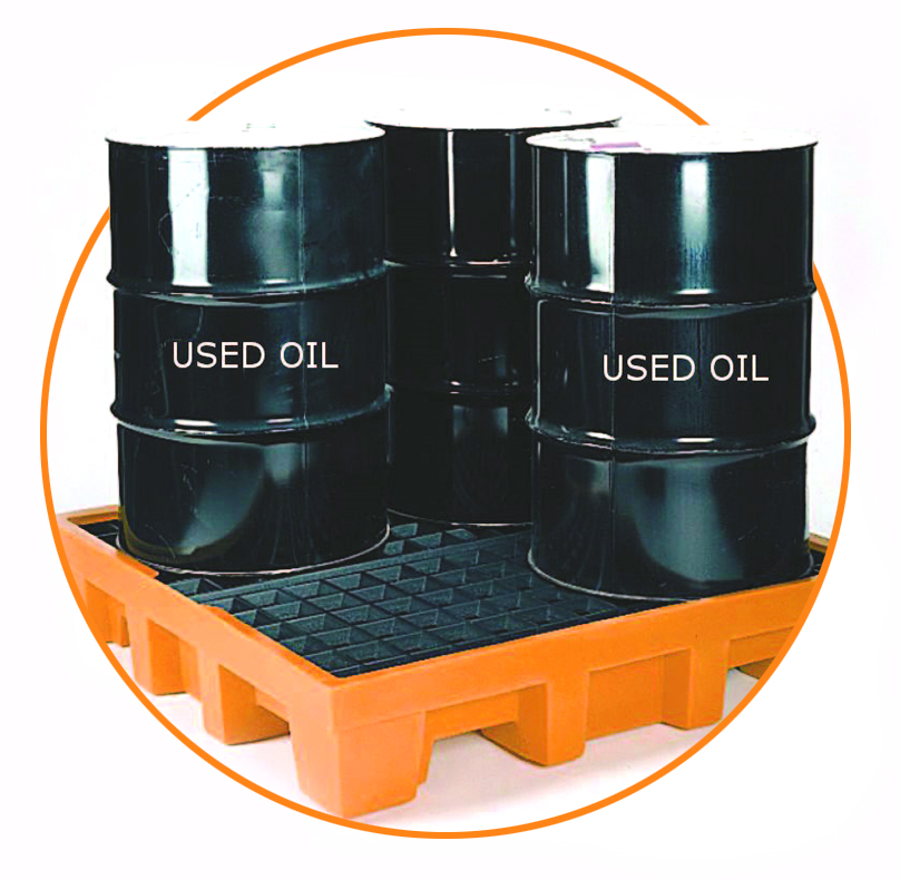 black barrels for used oil on an orange pallet