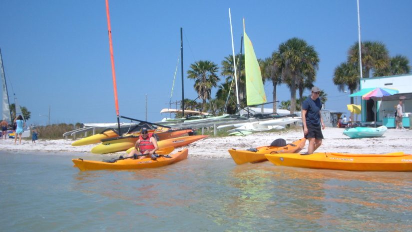 two women prepare to kayak on Dunedin Causeway