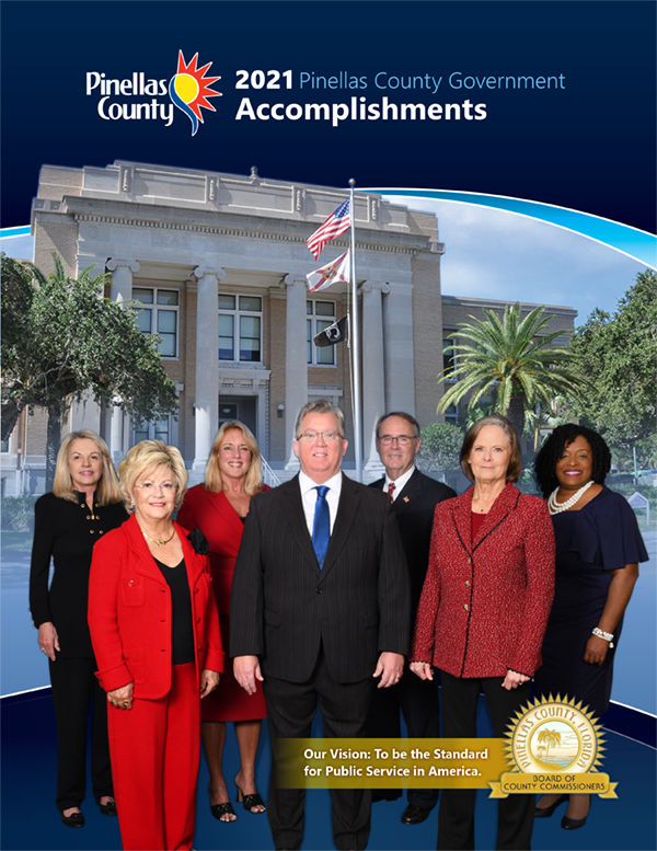 Seven County Commissioner stand in front of the County Courthouse for the cover of the 2021 Accomplishments Report