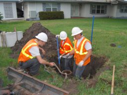 utilities staff working in front of a house