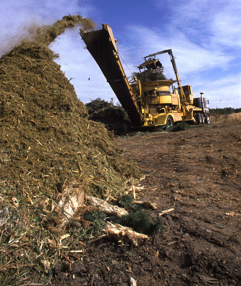 Mulch grinder grinding yard waste into mulch 