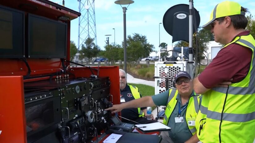 Photo of volunteers testing emergency communications equipment