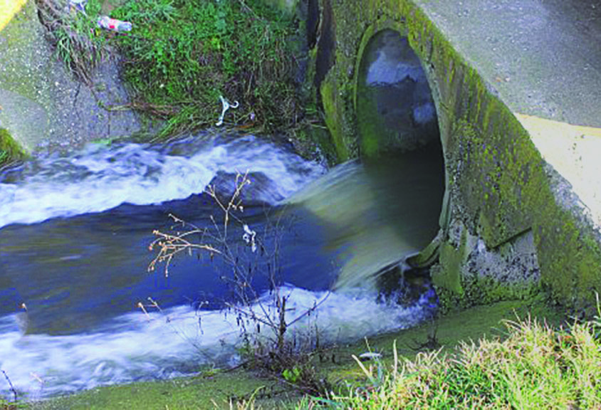 water flows through a stormwater outflow pipe
