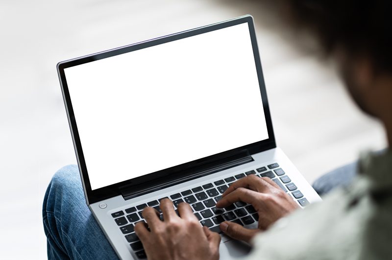 young man working on laptop