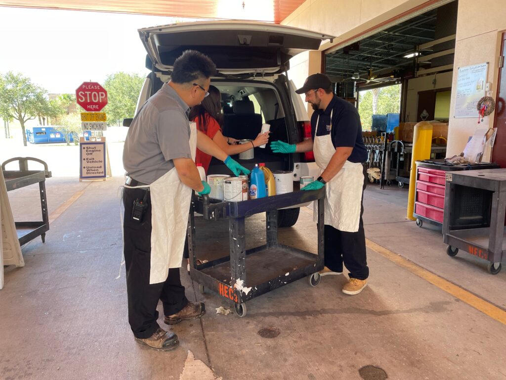 Customer unloading chemicals from their vehicle 