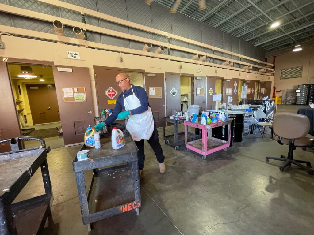 Staff separating and sorting chemicals 