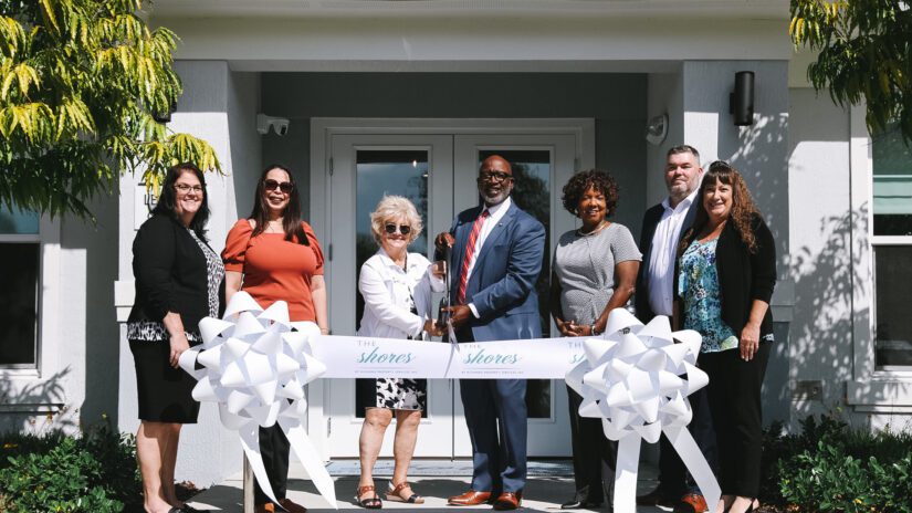 County and City officials cut the ribbon for The Shores apartment community.