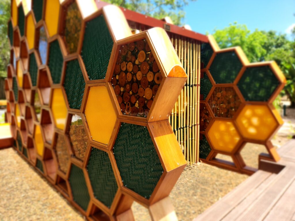 A photo of a playground structure resembling a honeycomb