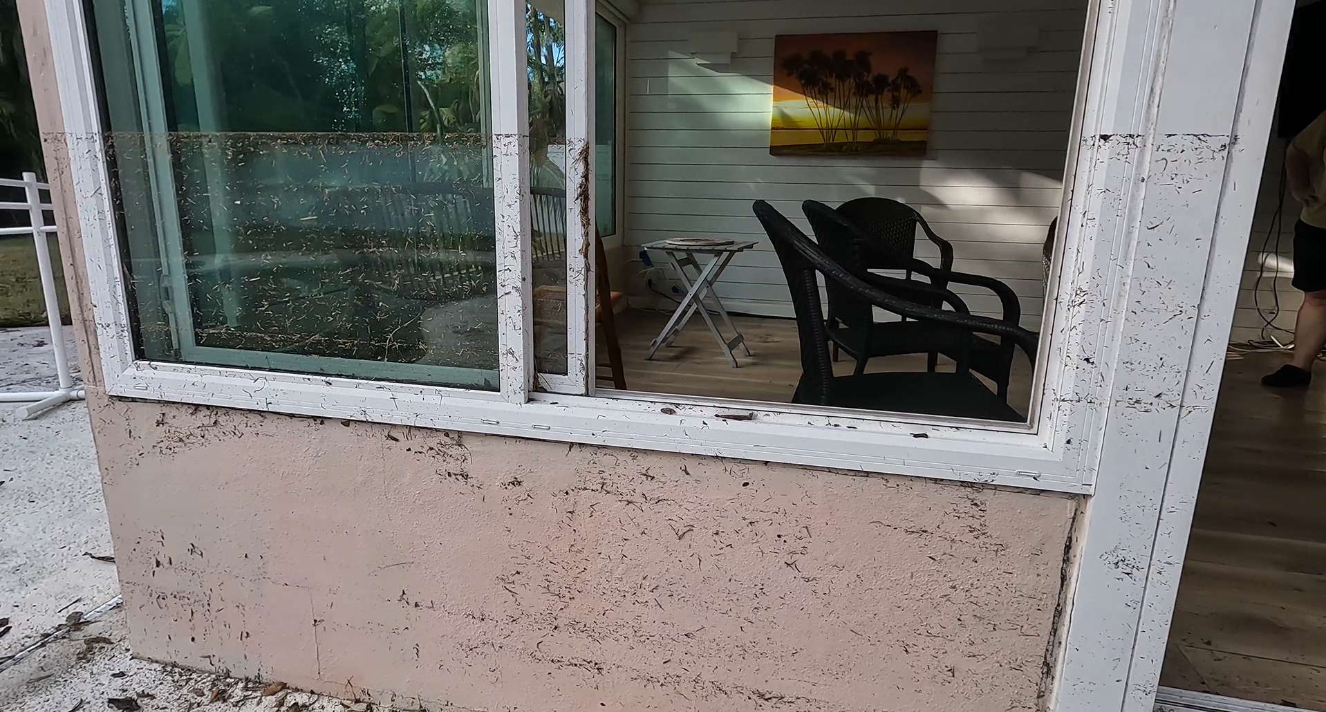 Home damaged by Hurricane Milton showing a water line several inches above the bottom of the window.