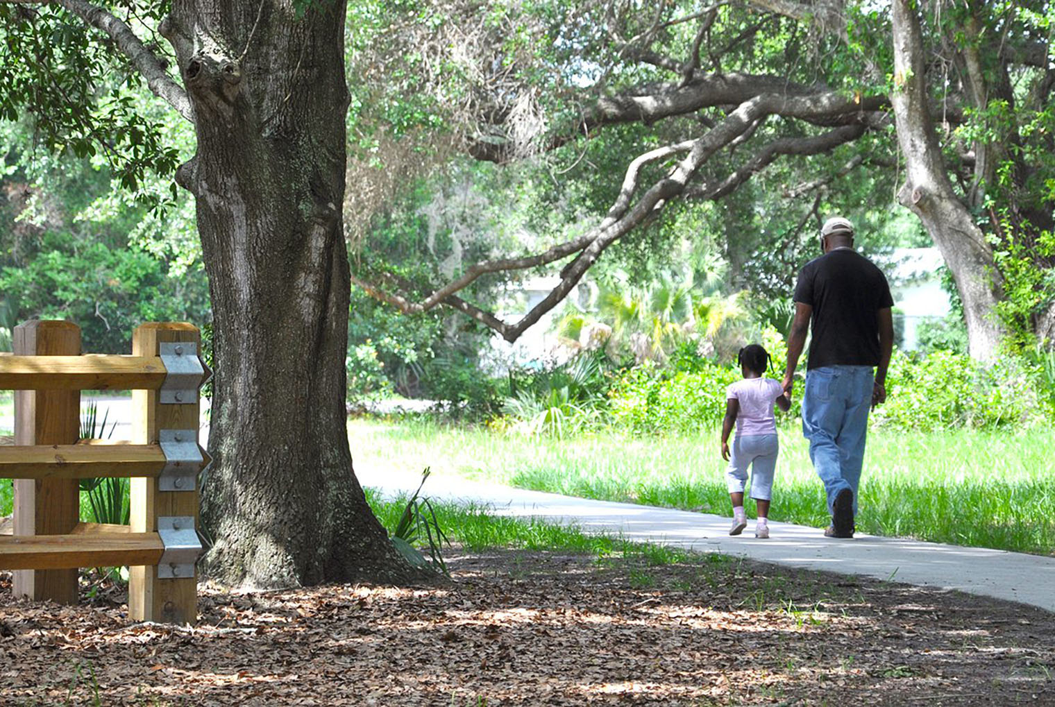 Father and daughter walk in Eagle Lake Park