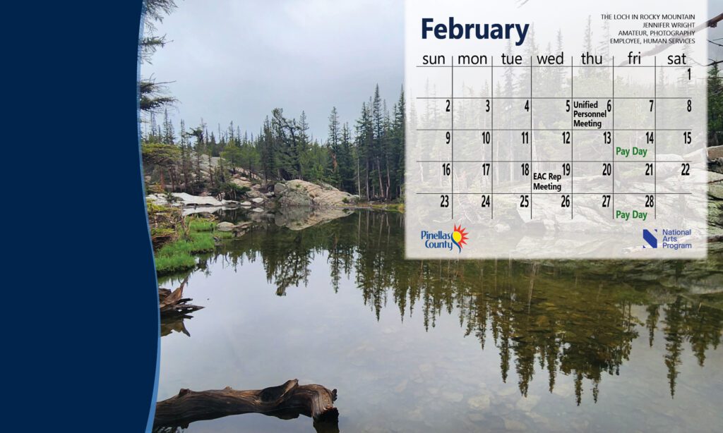 desktop calendar for February 2025 with image of mountains and lake
