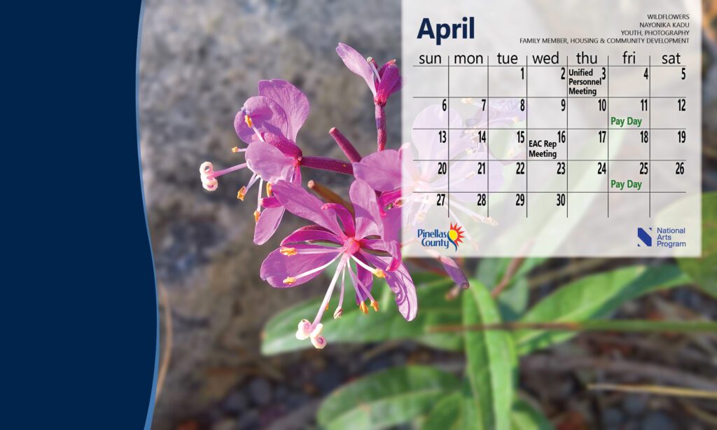 Desktop calendar for April 2025 with image of purple flowers