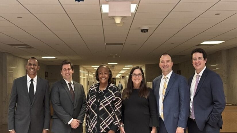 Photo of NALHFA members standing in a room side by side.
