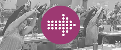 arrow over a photo of employees doing a group stretch