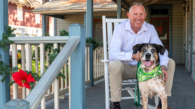 Pinellas County Commission Chair Scott at the historic Heritage Village with K-9 Sissy from Pinellas County Animal Services.