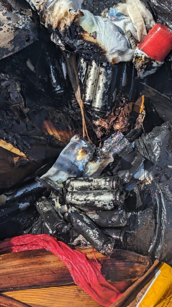 Image of burnt up lithium-ion batteries after being pulled from a garbage truck fire.