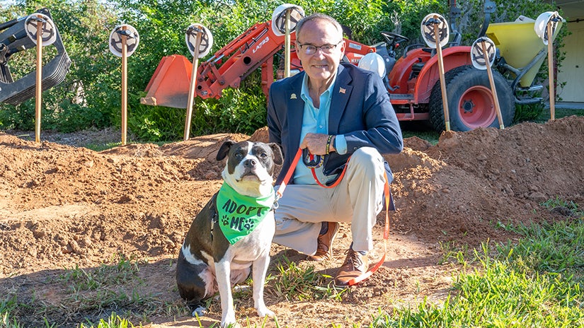 Adoptable K-9 Dumpling from Pinellas County Animal Service posing with Pinellas County Chair Dave Eggers at the Palm Harbor Rec Center ground breaking ceremony.