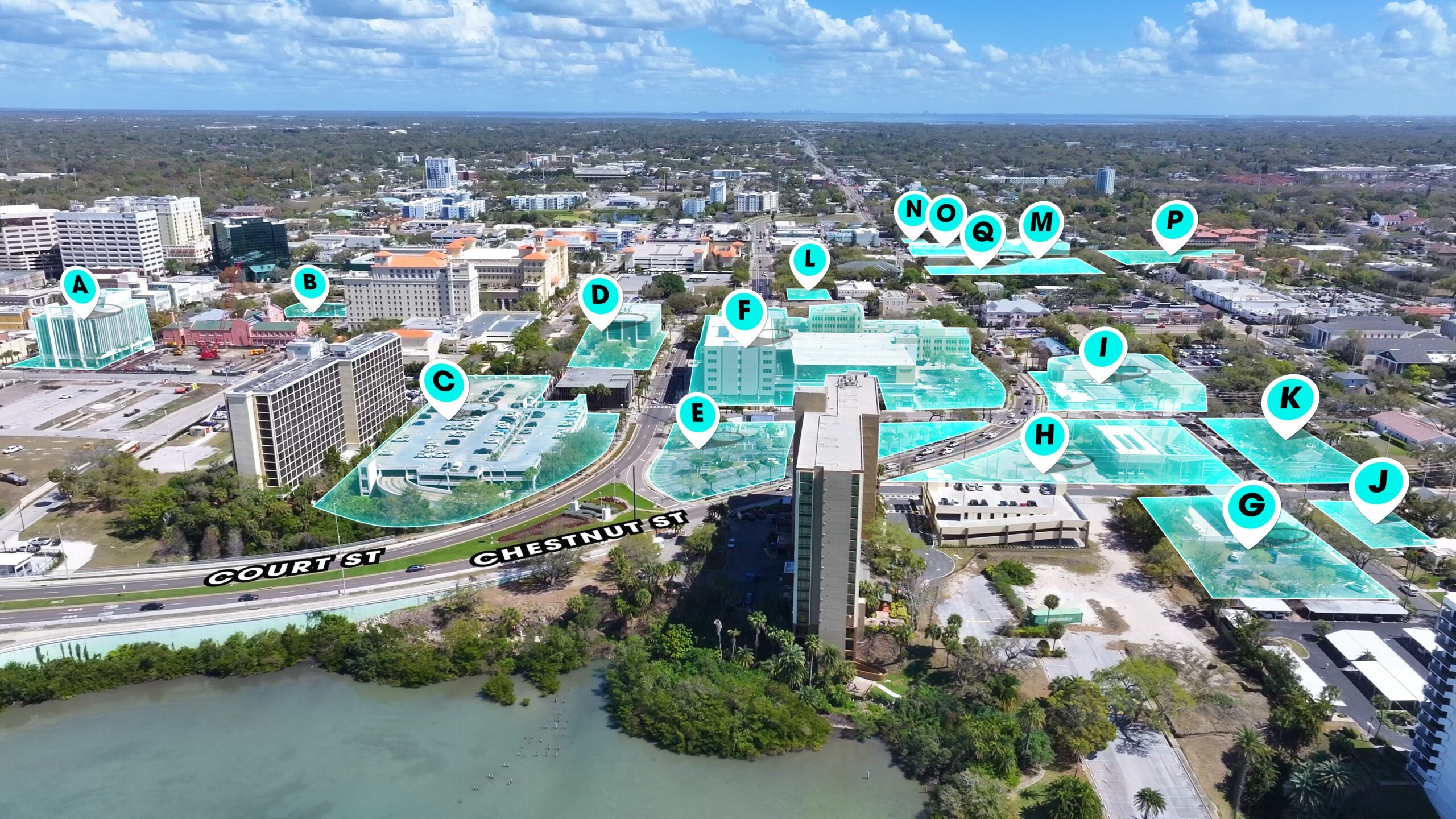 An aerial view of downtown Clearwater with 17 properties highlighted and labeled A through Q. Most are located in the core of downtown within blocks of the water.
