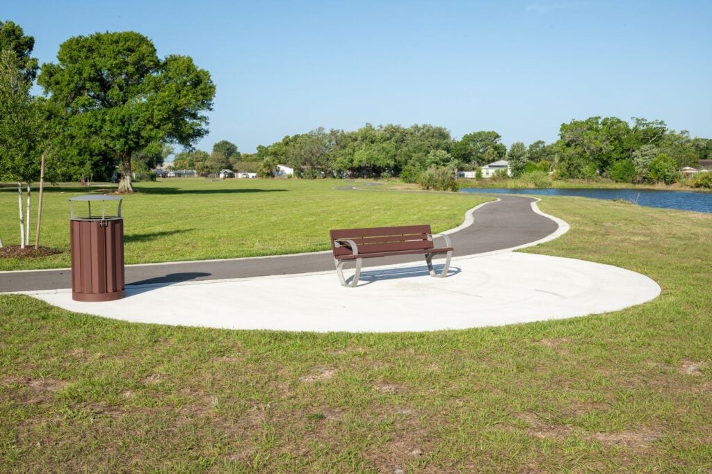Dansville Park bench and trash can.