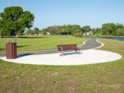 Dansville Park bench and trash can.