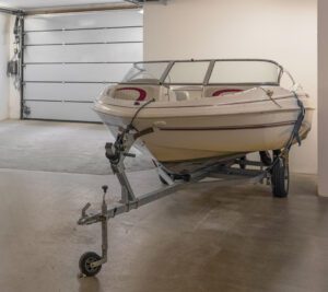 Photo of a boat on a trailer in an enclosed area.