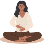 Woman sitting cross legged holding her stomach 